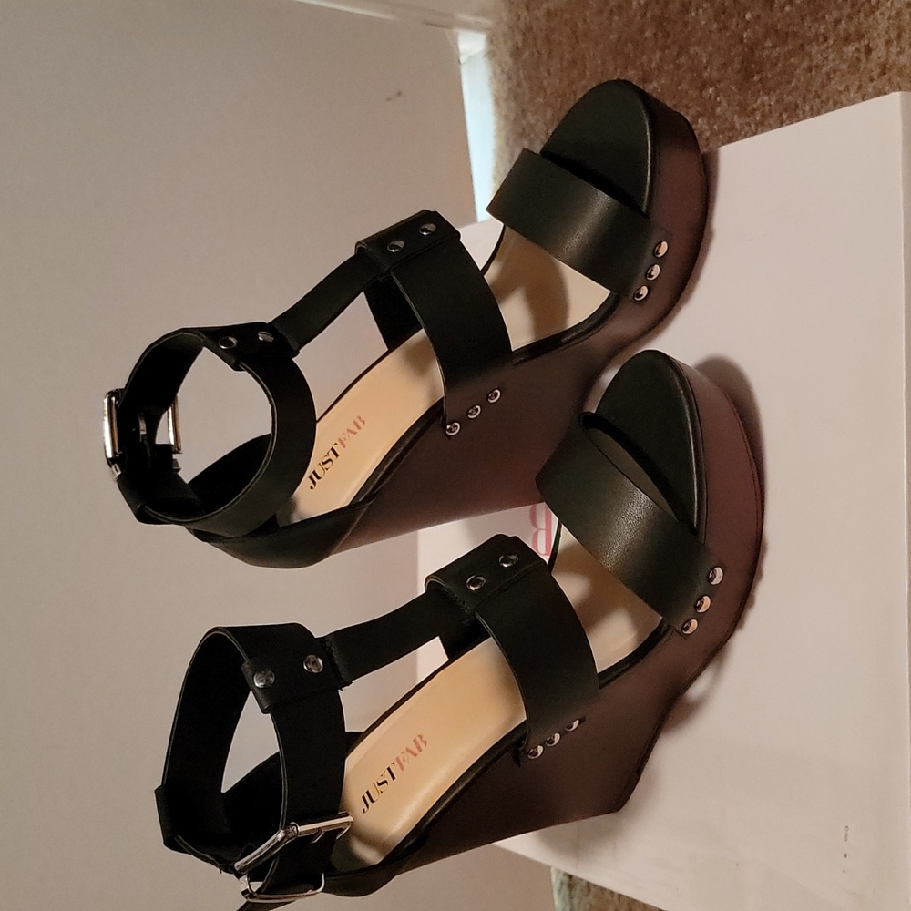 Just Fab worn once.  Black size 7 1/2